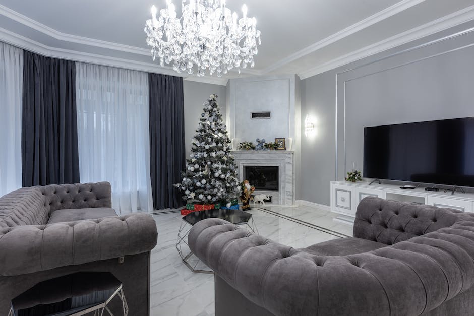 A high-quality, luxury Christmas tree in a beautifully decorated living room