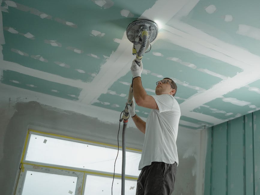 Image of person repairing drywall, fixing squeaky doors, and patching up paint, enhancing the look and feel of a home.