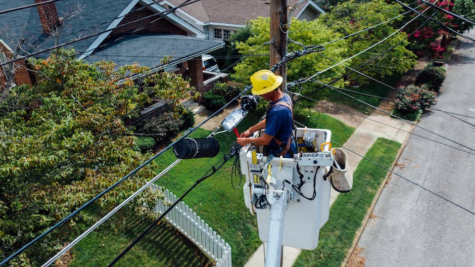Image of a person working with electrical wires